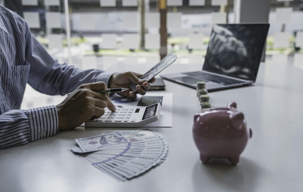 Business man counting banknotes in his hands profiting from the business For saving money, saving mo