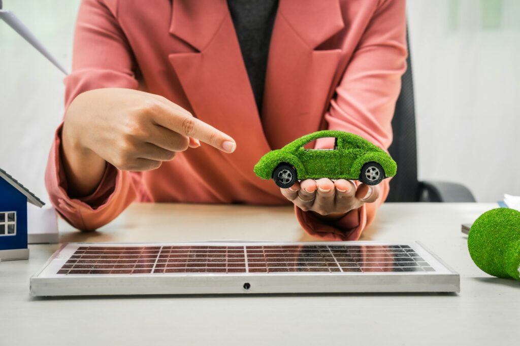 Female entrepreneur working at desk in clean energy sector Focusing on wind turbines solar energy